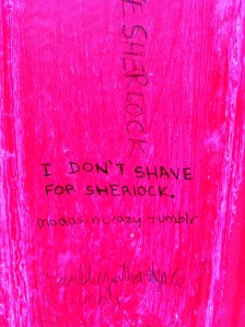 Graffiti on a phone box, stating 'I don't shave for Sherlock'